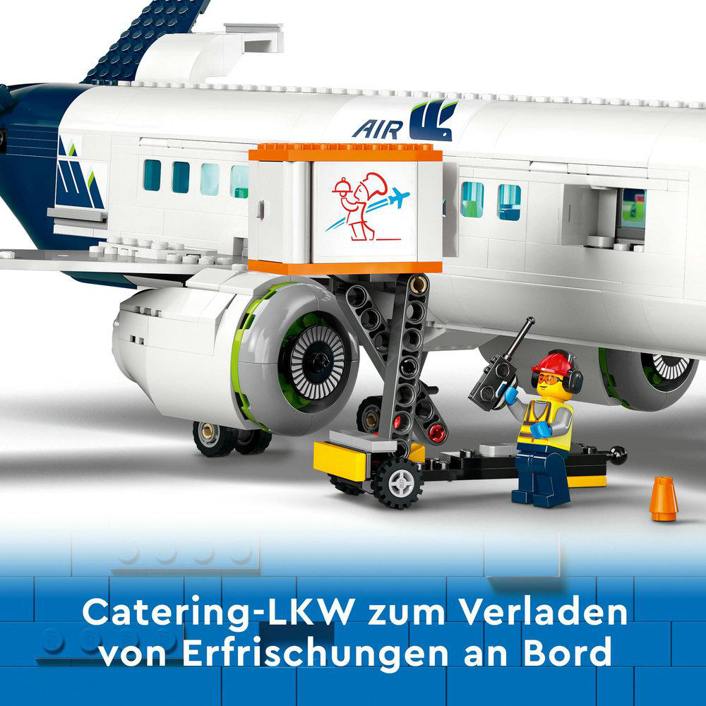 Ein Lego-Flugzeug mit Catering-LKW, der Essen lädt. Ein Arbeiter steht daneben.