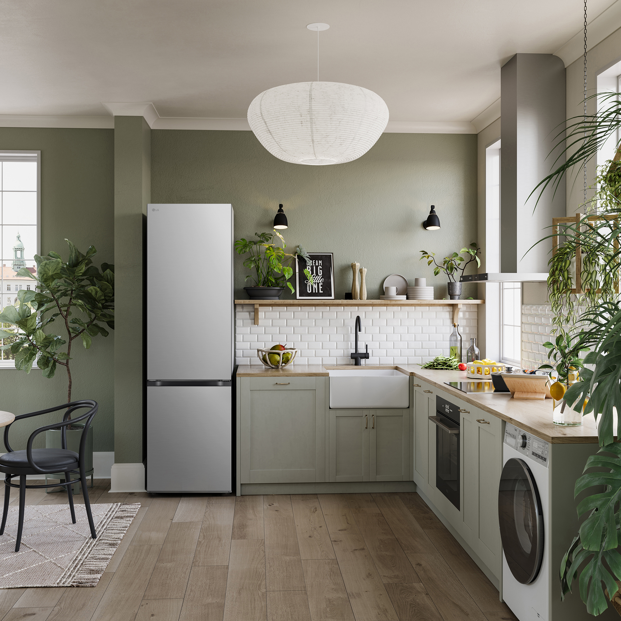 Una cocina moderna con nevera, plantas y lavadora.