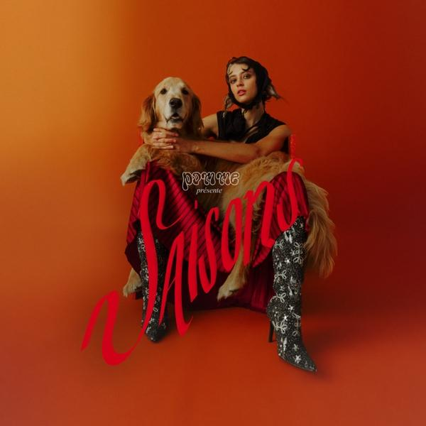 Albumcover mit einer Frau, die einen Hund umarmt. Roter Hintergrund und roter Schreibschrift-Text.
