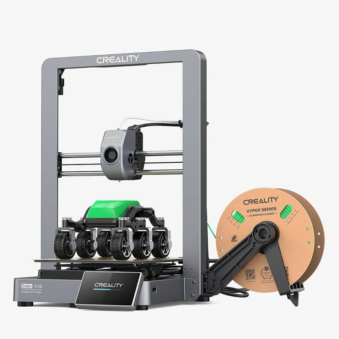Platformda yeşil bir model ve kahverengi bir filament makarası olan bir 3D yazıcı.