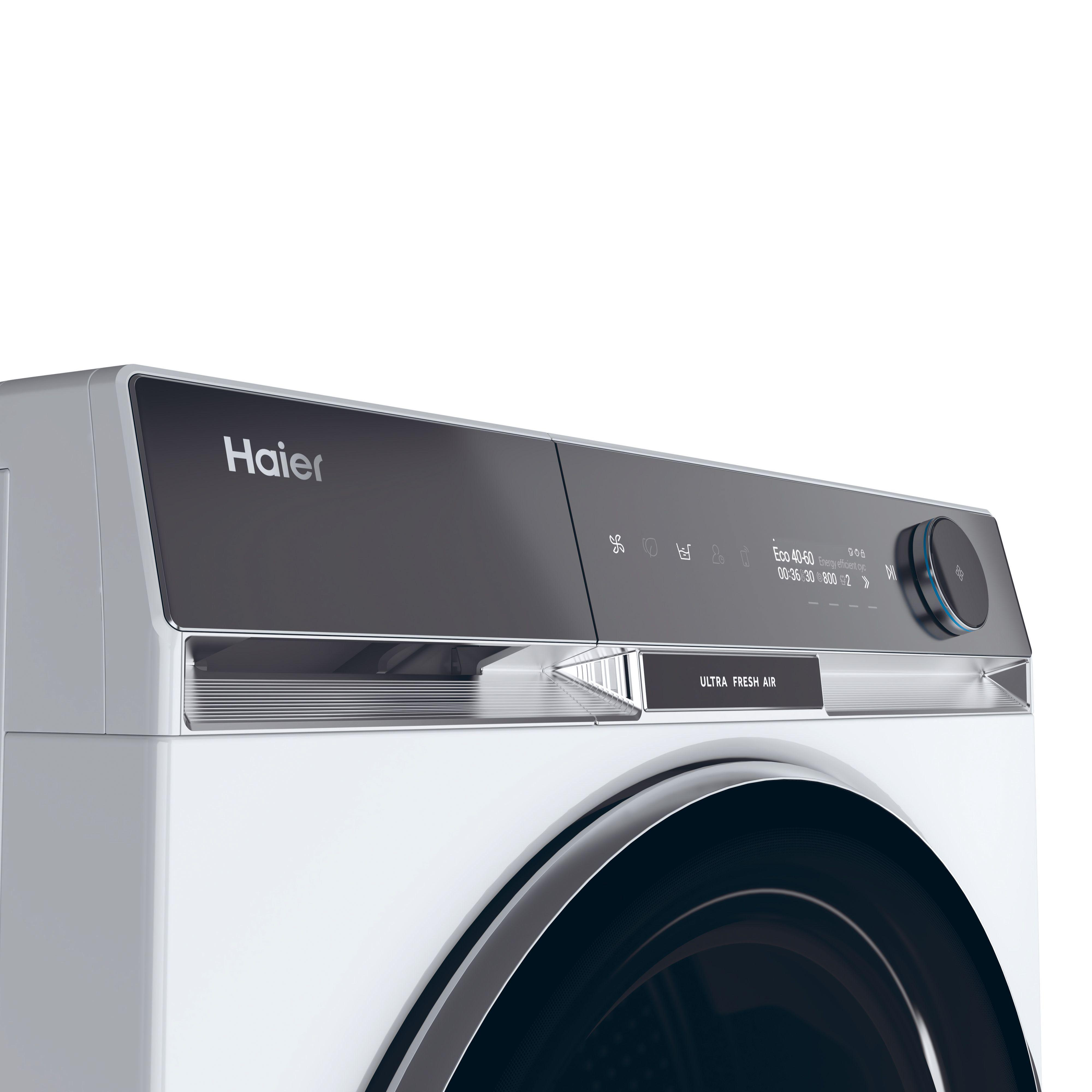 Nahaufnahme des Bedienfelds einer Haier Waschmaschine, mit schwarzem Hintergrund.