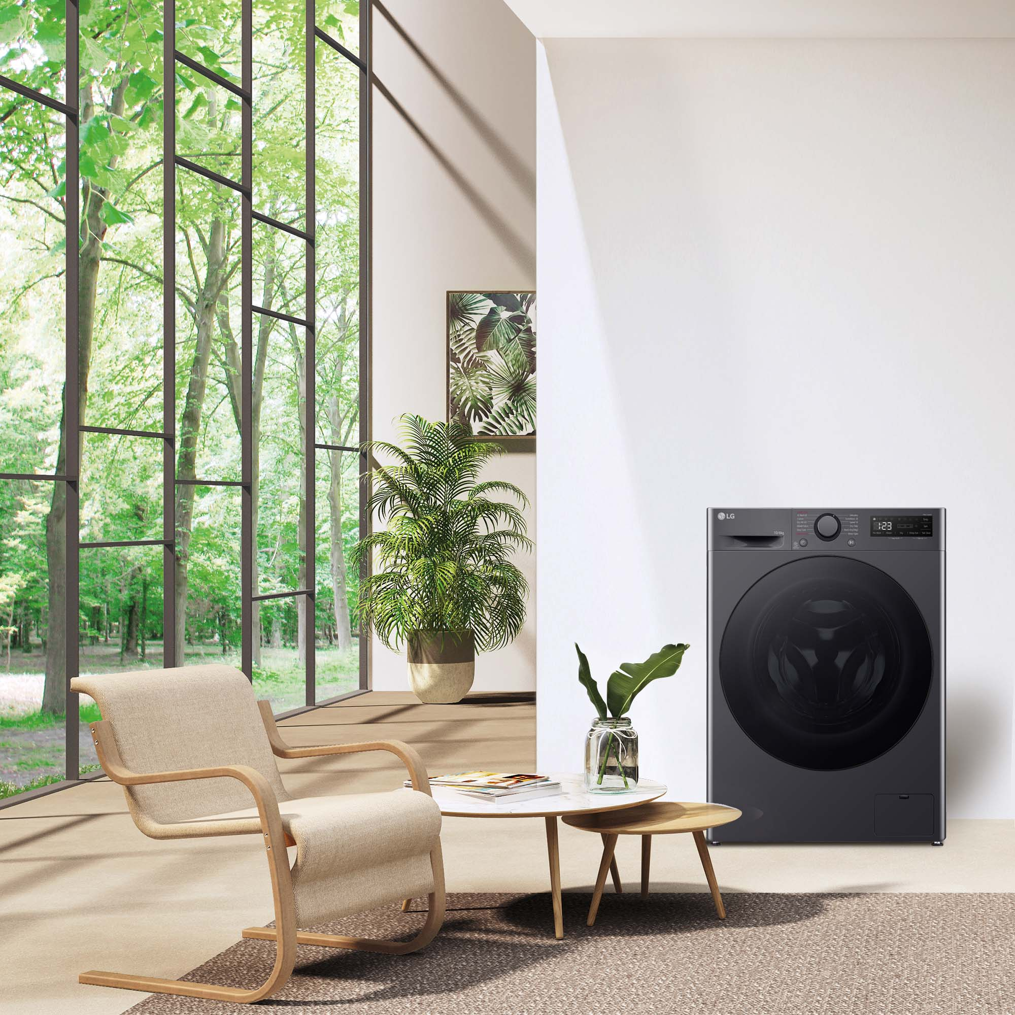 Una lavadora negra en una habitación moderna con vista a la ventana.