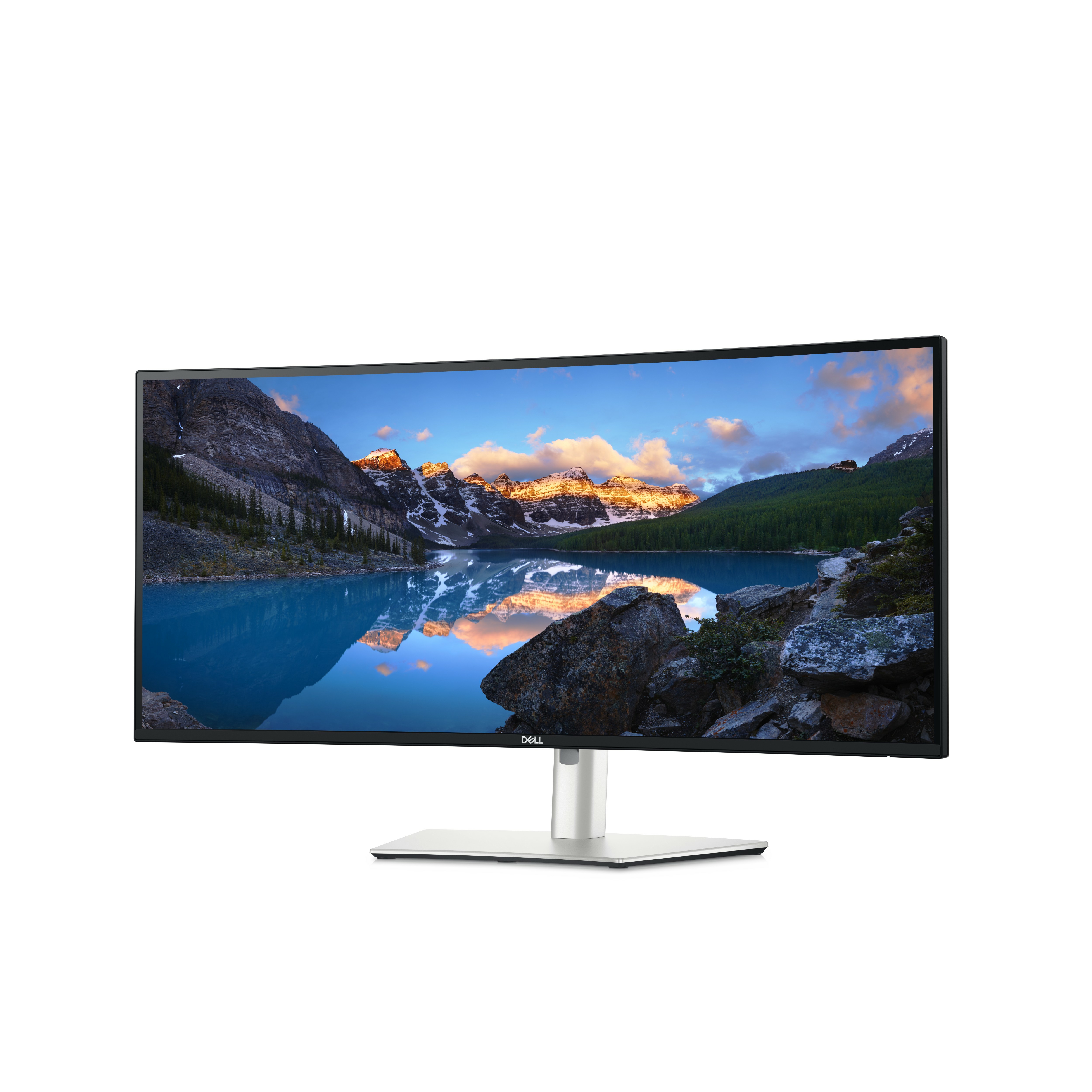 Ein Dell-Monitor zeigt eine malerische See- und Berglandschaft. Der Monitor hat einen silbernen Ständer und einen schwarzen Rahmen.