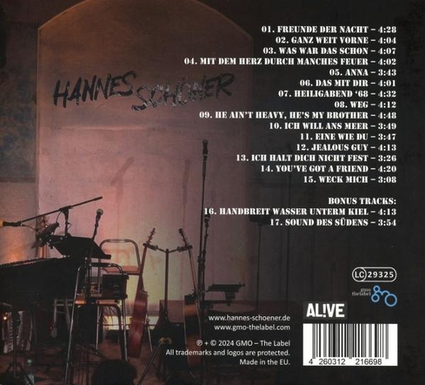Albumcover: Ein Mann singt mit einem Hintergrund aus Musikinstrumenten und Text.