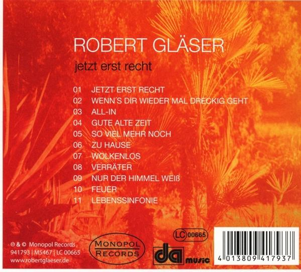 Albumcover mit Text und rotem und orangefarbenem Hintergrund. Enthält Songtitel und Künstlerinformationen.