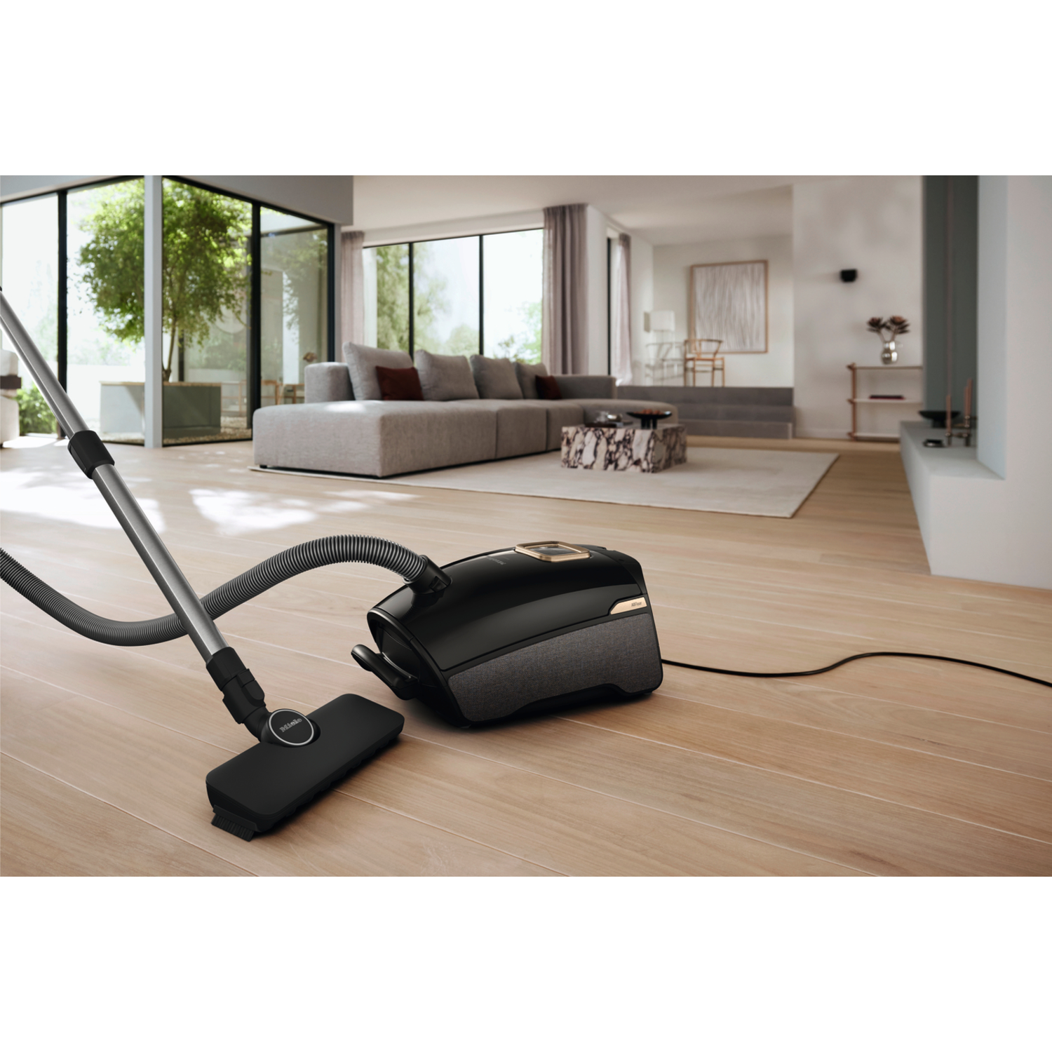 A vacuum cleaner on a wooden floor.