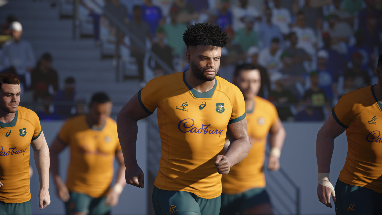 Jugadores de rugby con camisetas doradas corren por el campo.