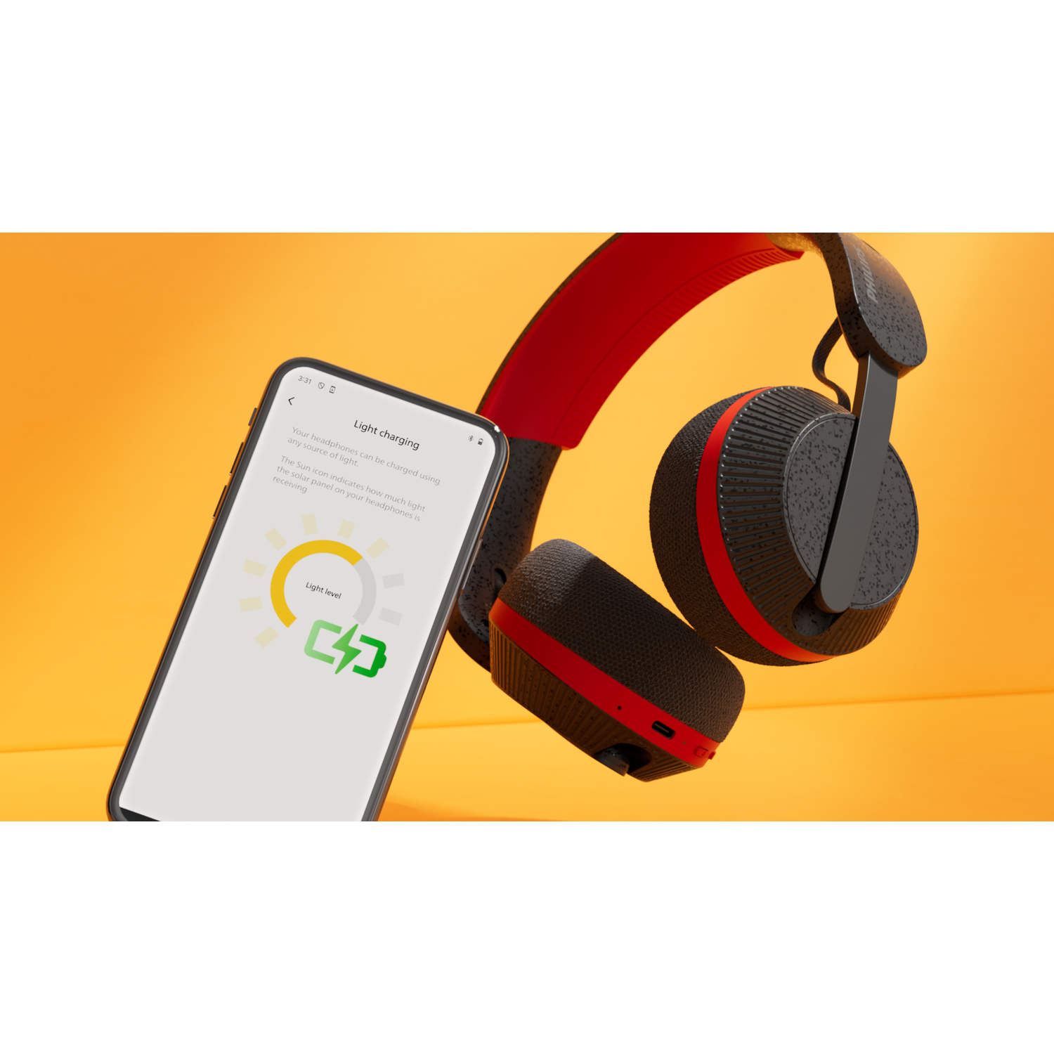 Een smartphone met informatie over het opladen, naast een zwarte en rode koptelefoon, op een oranje oppervlak.