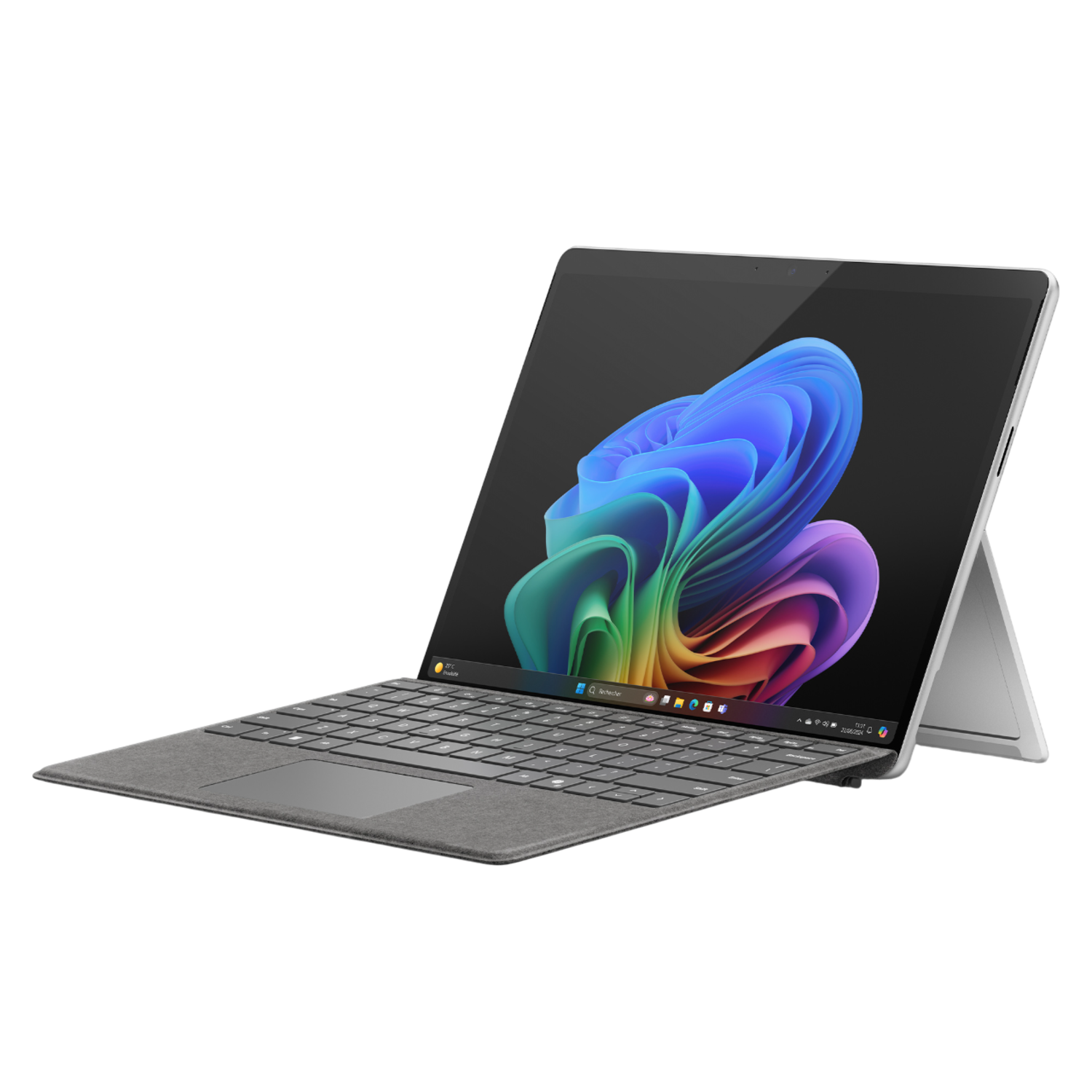 Laptop: Silver, open. Displays colorful abstract image. Keyboard attached.