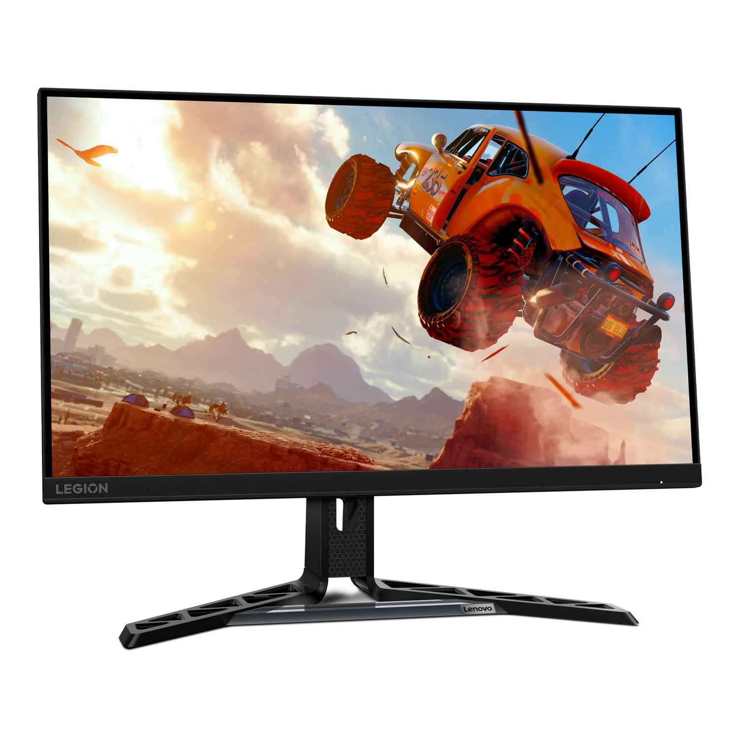 Lenovo Legion monitor displays a car racing on a track. The car is orange, and the background is a sunset.