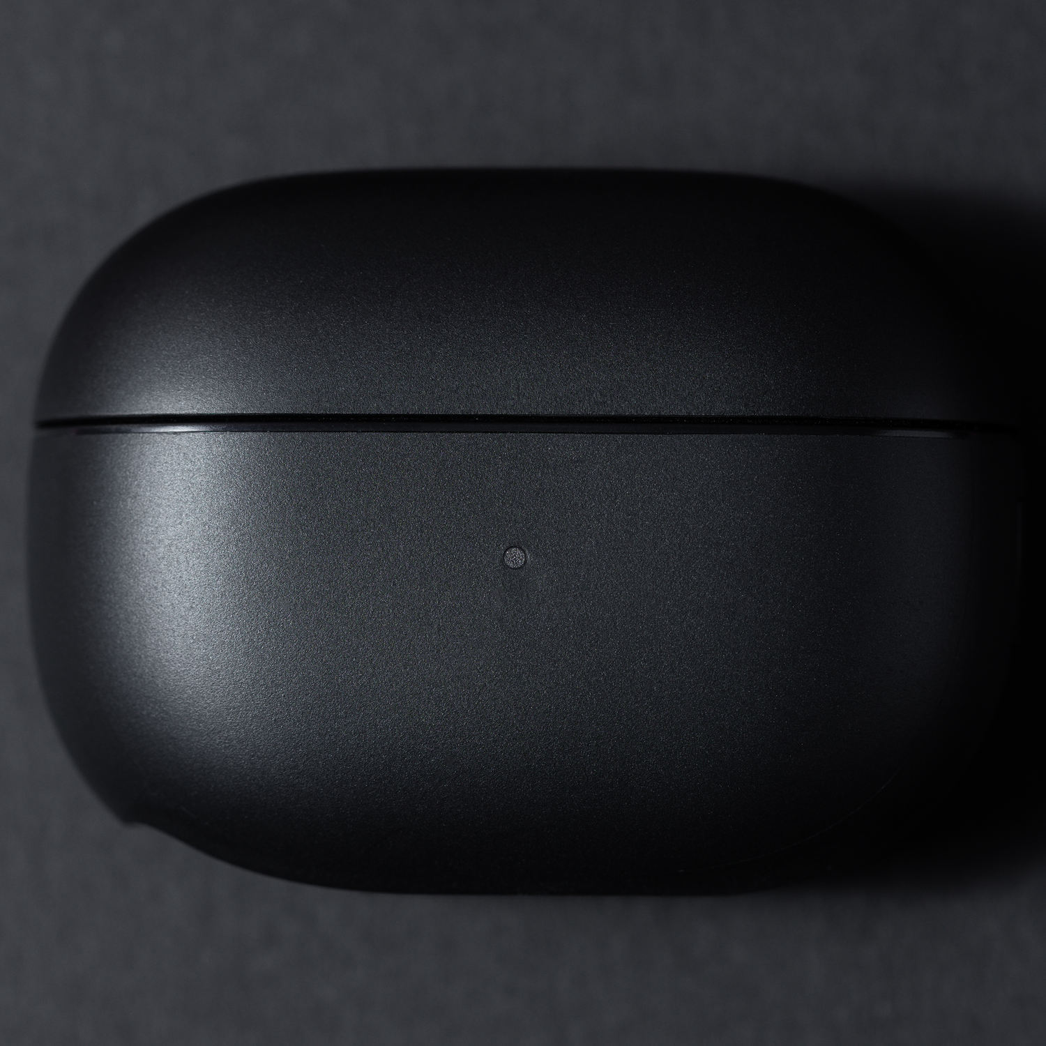 Black charging case closed. Simple design on a black background.