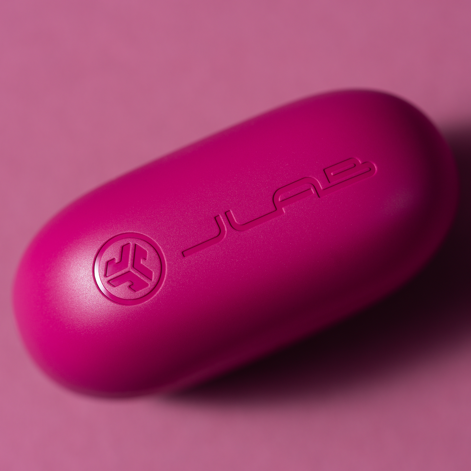 Close up of a pink charging case.