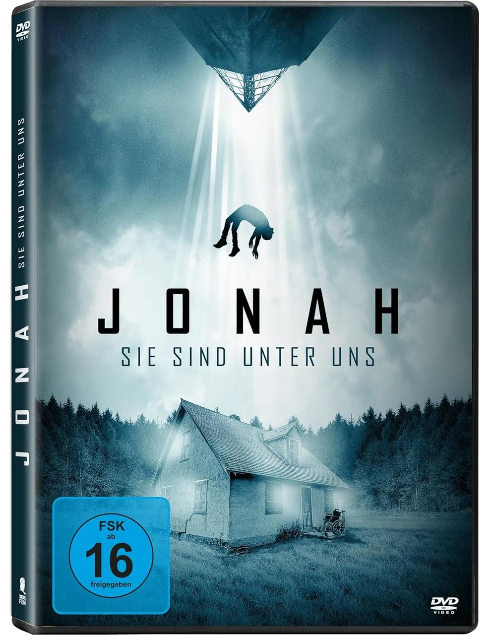 DVD-Cover: Eine Figur fällt von einem Lichtstrahl auf ein Haus im Wald.