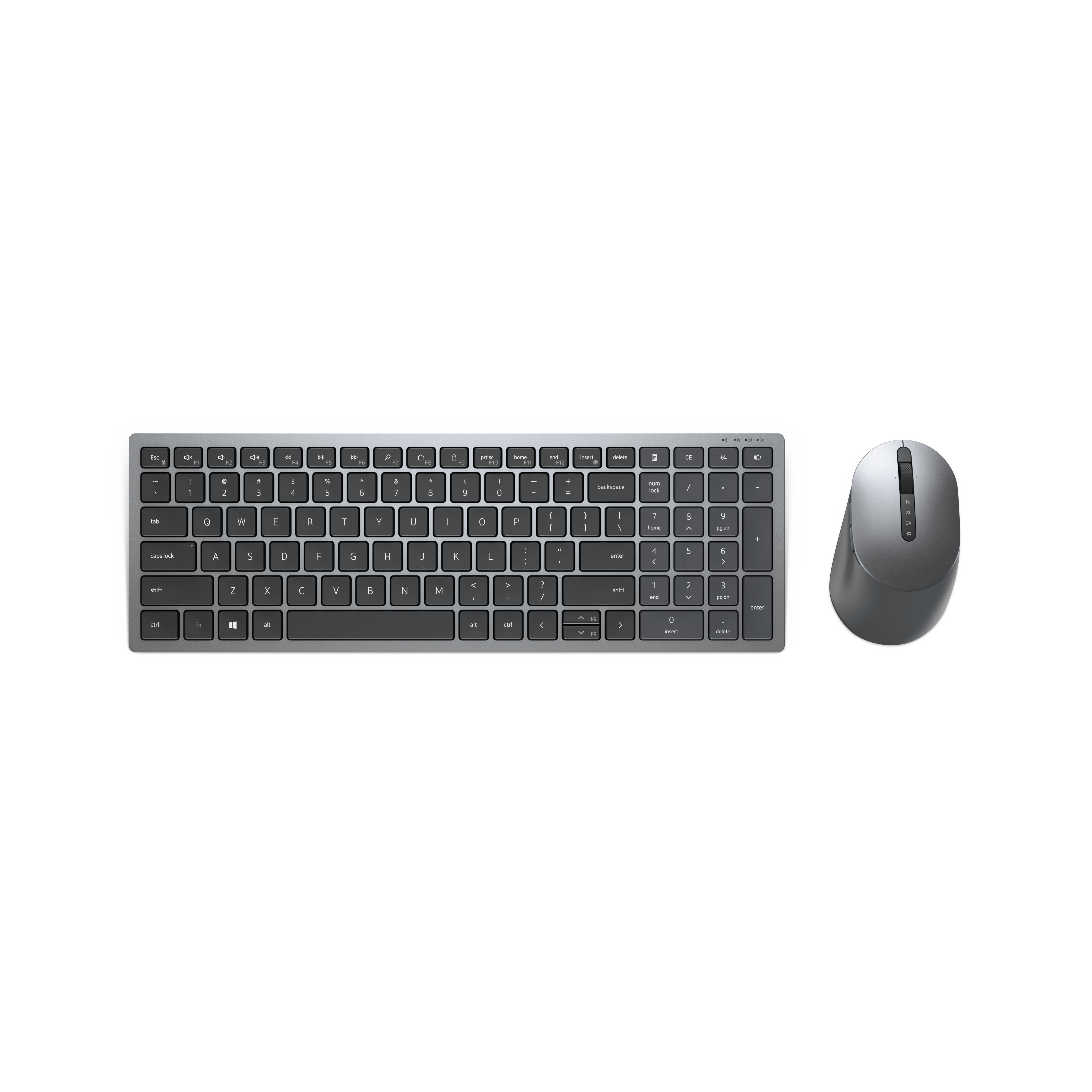Conjunto de teclado y ratón, el teclado es plano y gris, el ratón curvado y gris, fondo blanco.