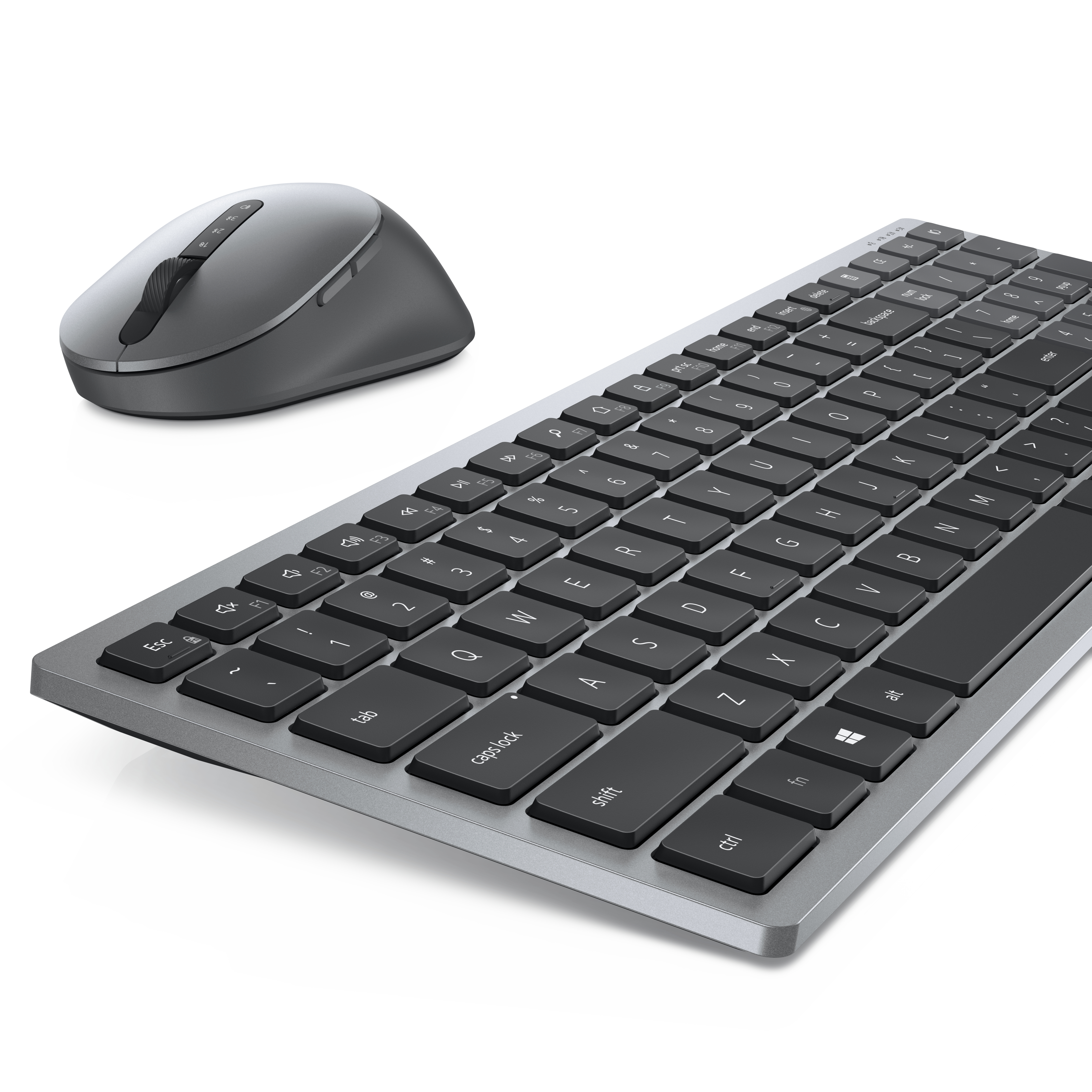 Un teclado y un ratón grises sobre un fondo blanco. El teclado tiene teclas negras.