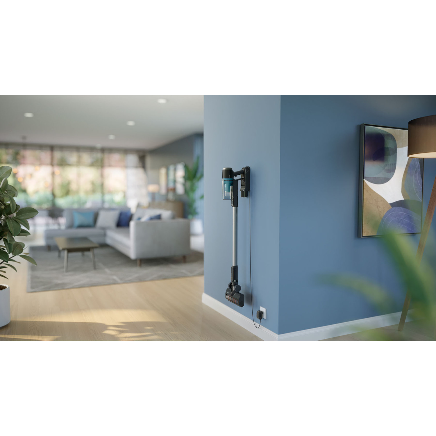 Cordless vacuum cleaner on a wall mount, in a living room.