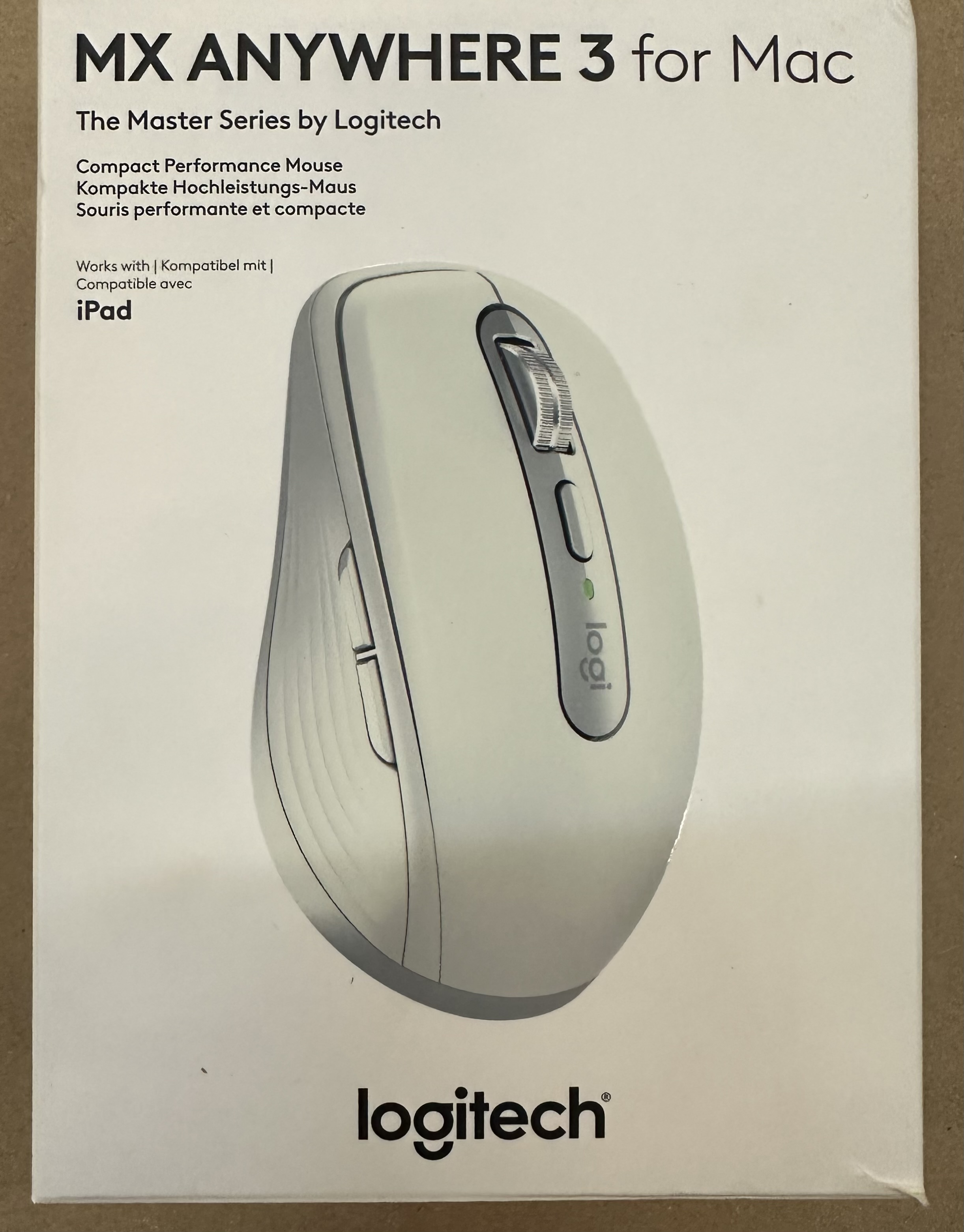 Opakowanie myszy Logitech MX Anywhere 3 z myszą na pierwszym planie.
