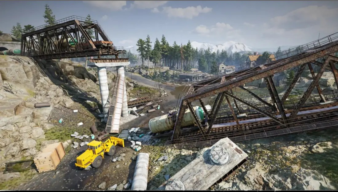 Ingestorte spoorbrug met gele graafmachine, wagons en bergen op de achtergrond.