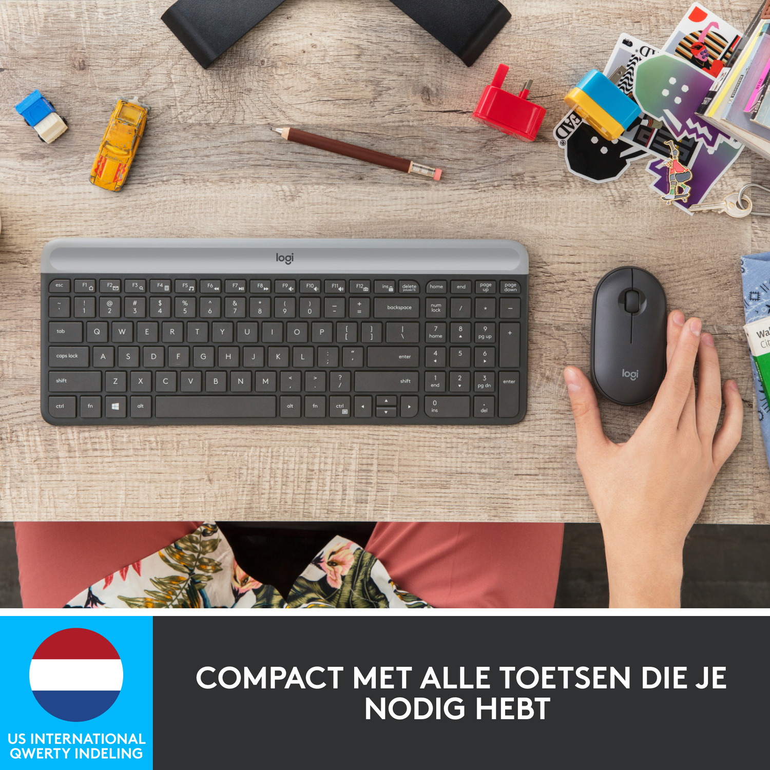 Keyboard and mouse on a wooden desk with small items.