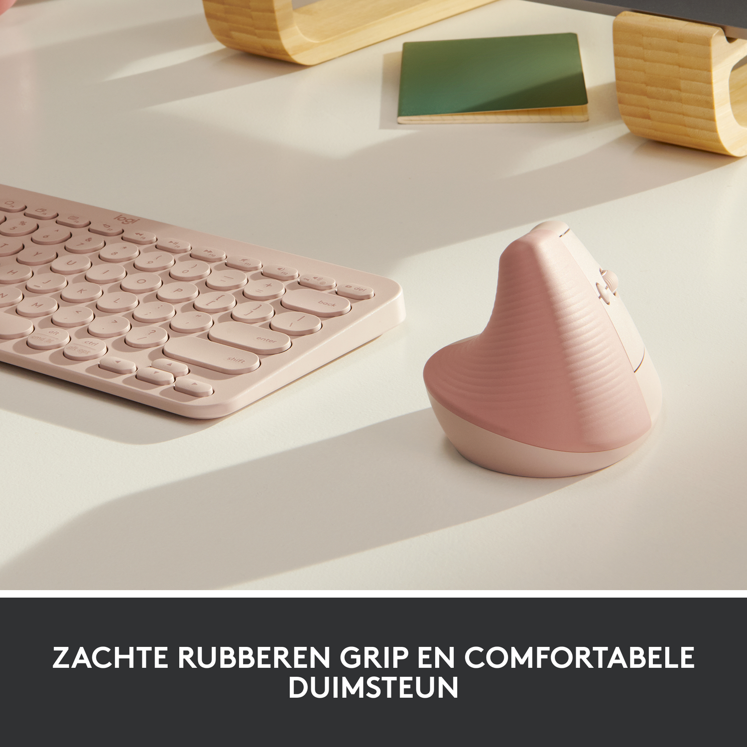 Pink keyboard and ergonomic mouse on a white desk. Text reads: soft rubber grip and comfort.