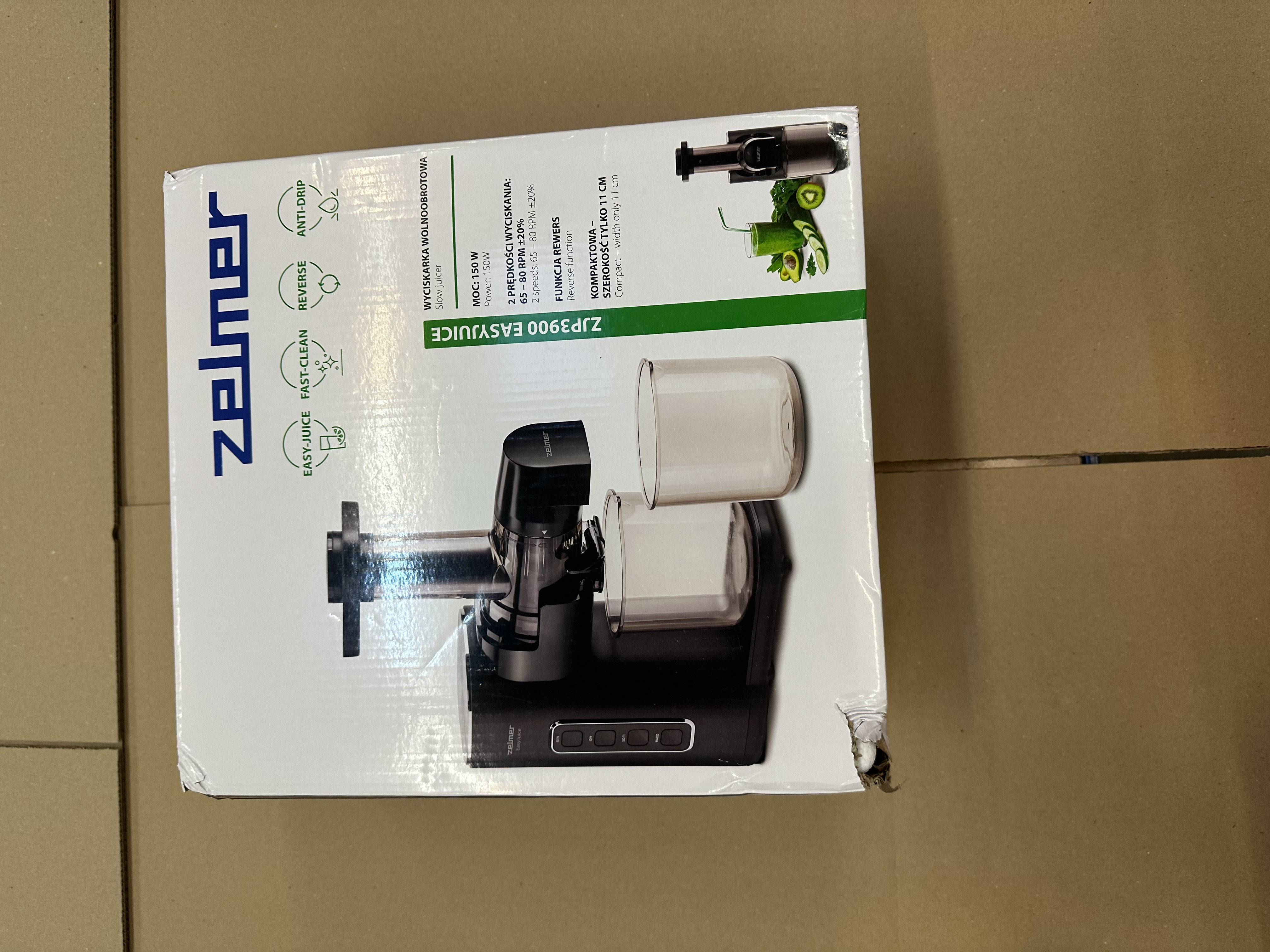 Pudełko wyciskarki z wyciskarką w środku.