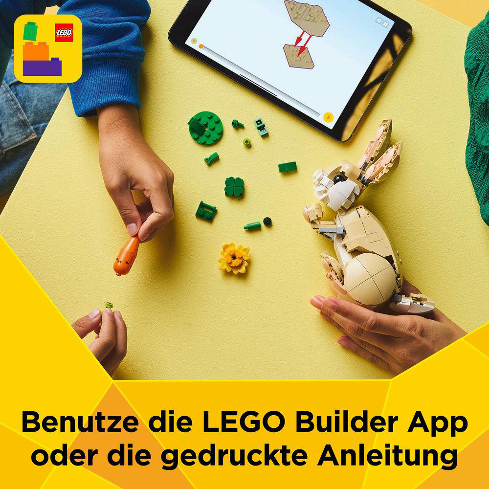 LEGO-Set-Montage mit Tablet und Bauanleitung.