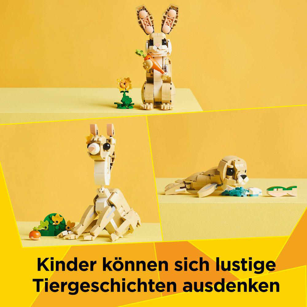 Blocktiere: Hase mit Karotte, Löwe, Giraffe und Robbe. Gelber Hintergrund.