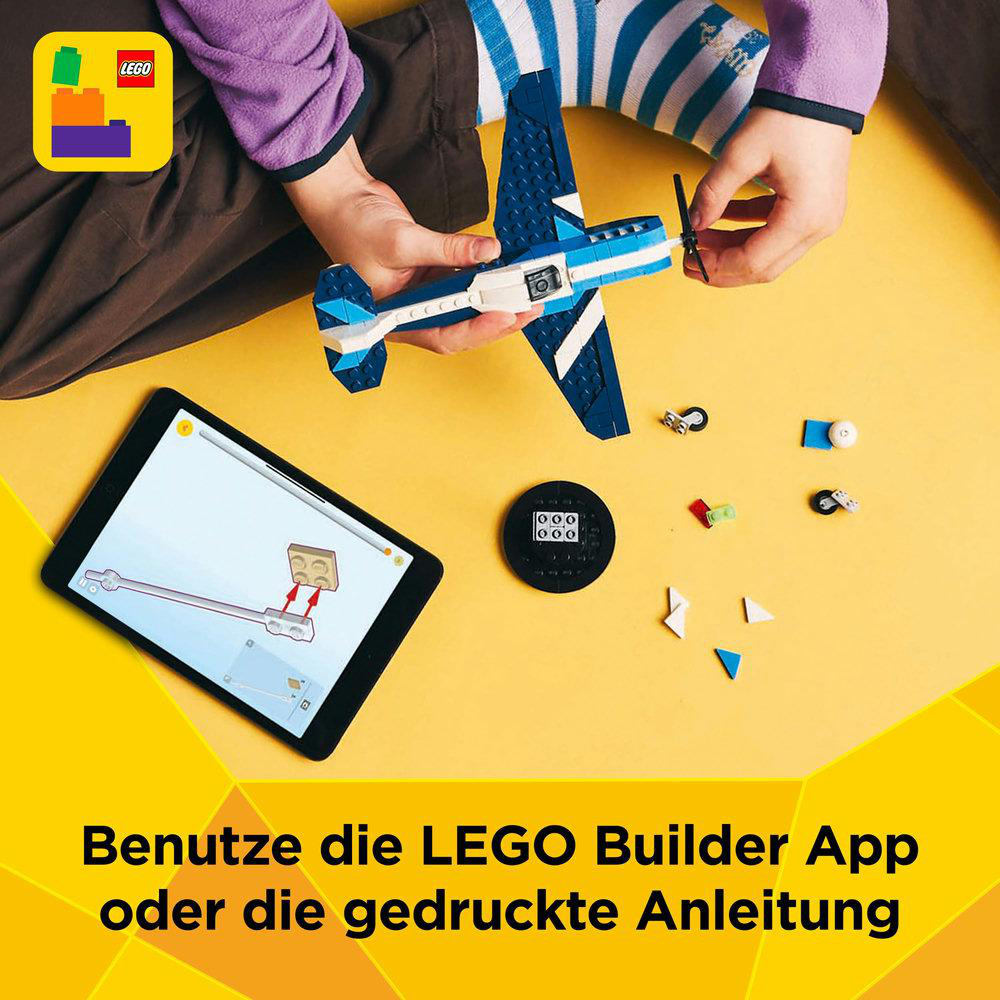 Ein Tablet mit LEGO-Anweisungen. Text: Verwende die LEGO Builder App oder die gedruckte Anleitung.