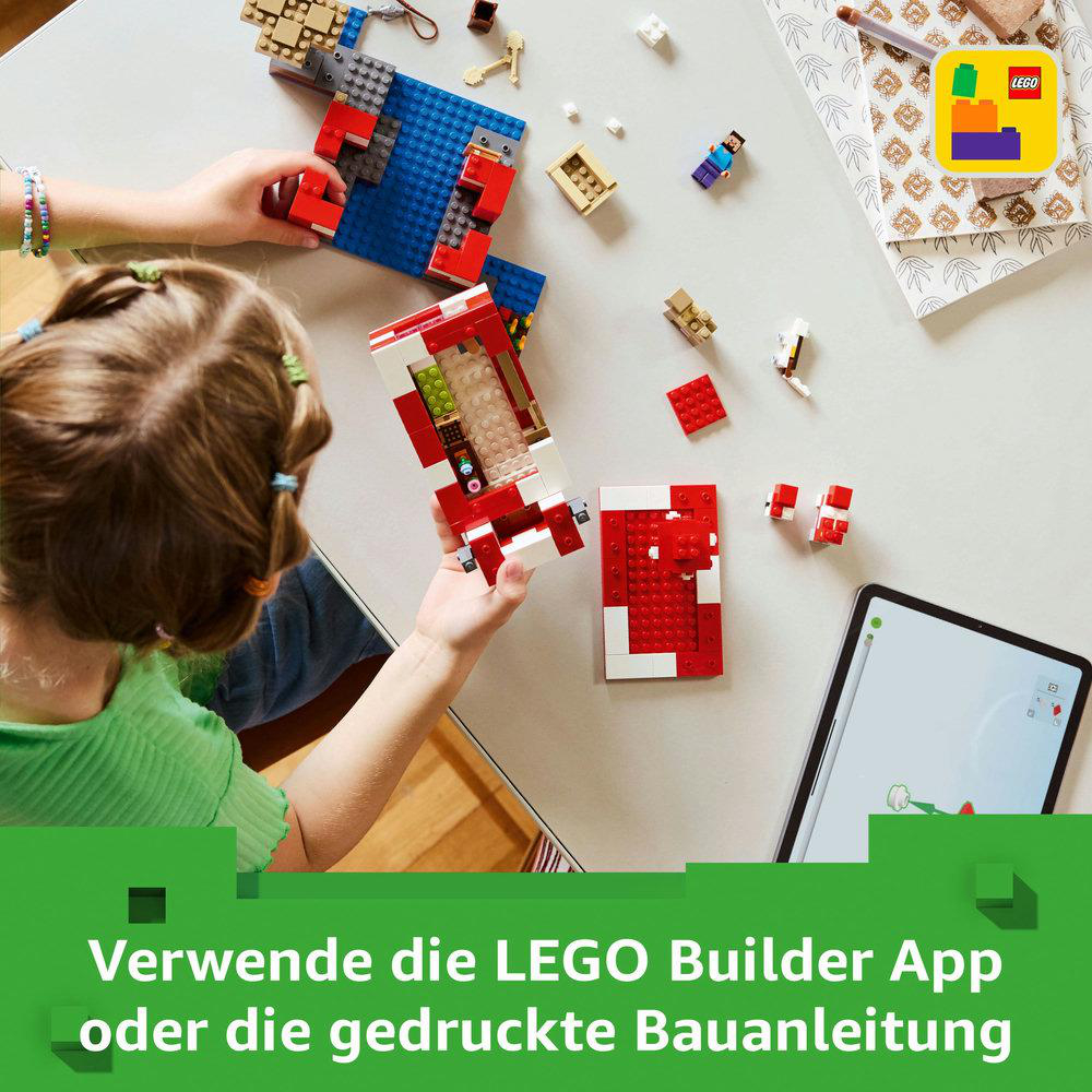Kinder spielen mit LEGOs, bauen ein Modellauto, mit Tablet-Anleitung.