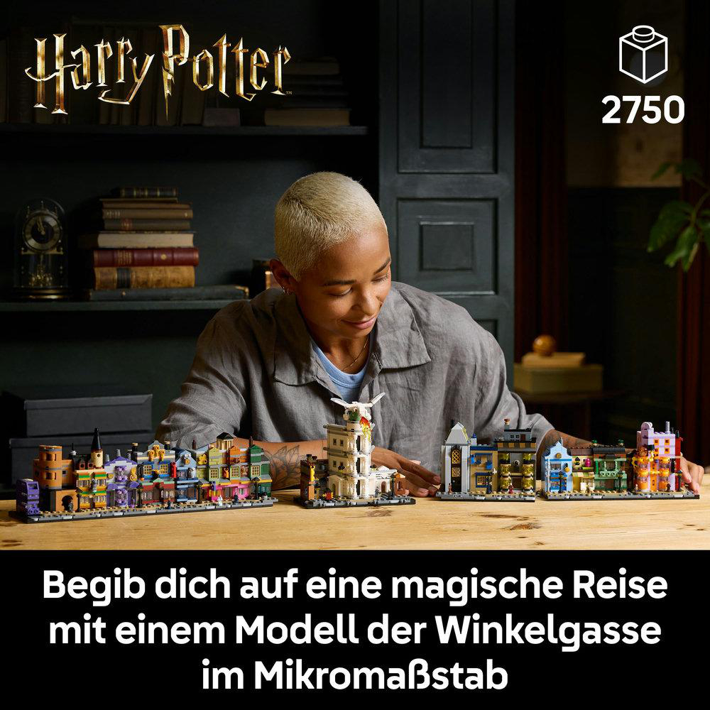 Person mit Lego-Set, baut eine Mikromaßstab-Straße.