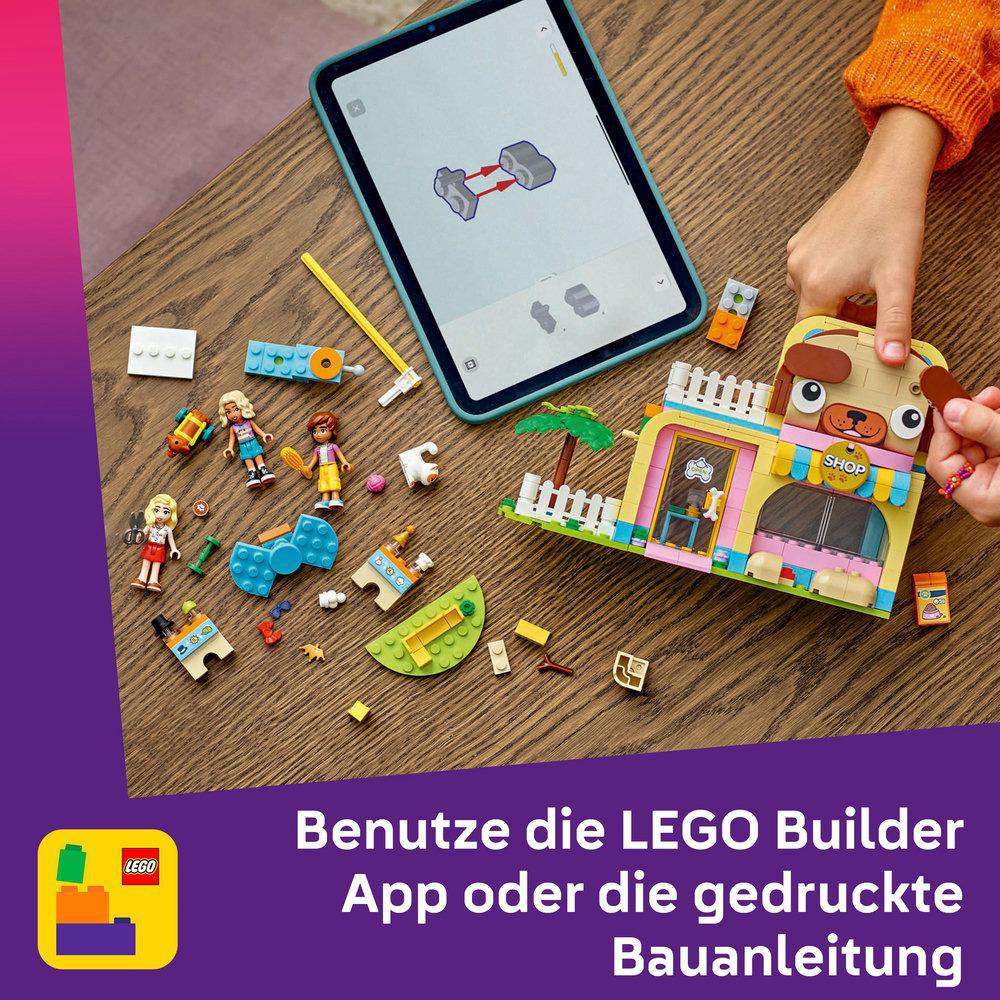 LEGO-Set mit Tablet, das Anweisungen zeigt, und Kinderhänden.