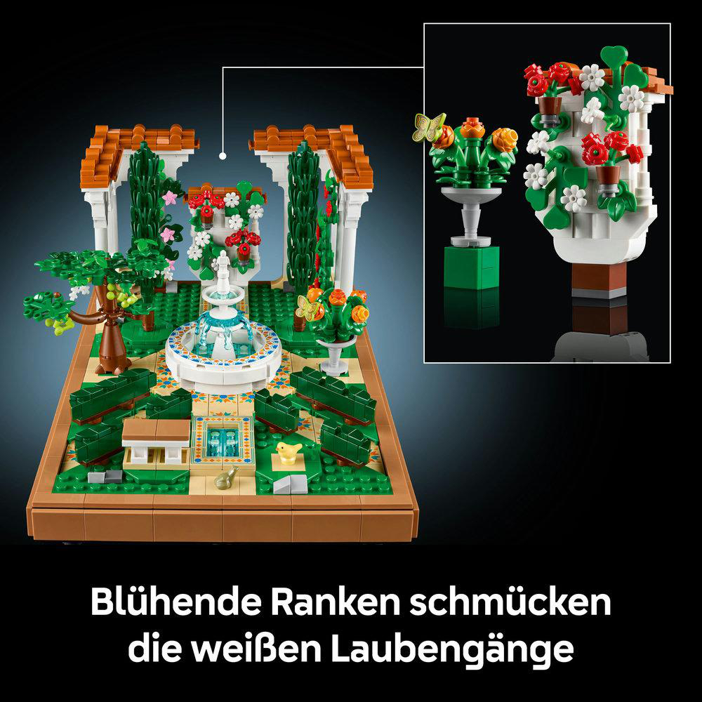 Lego Gartenszene mit Brunnen, Blumen und weißen Torbögen.