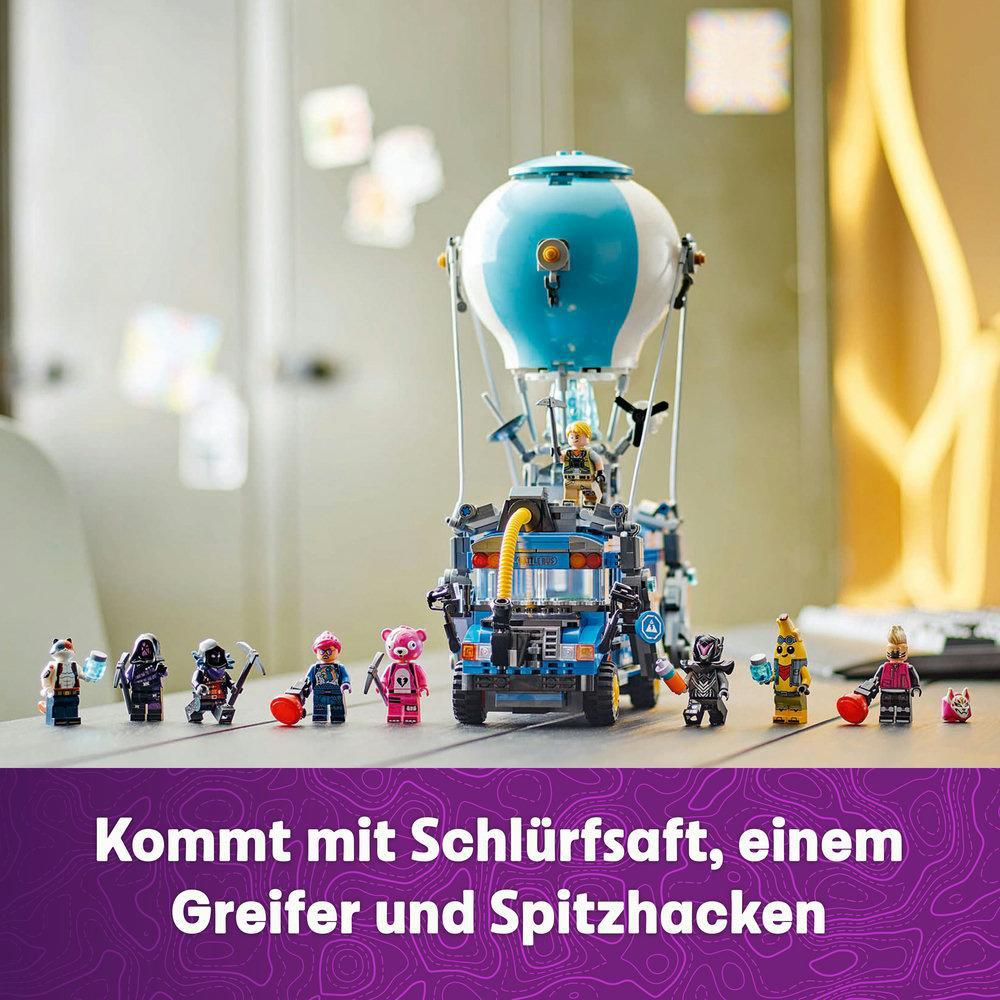 LEGO-Set mit Bus, Figuren und Heißluftballon. Enthält Schmatzsaft, Greifer und Spitzhacke.