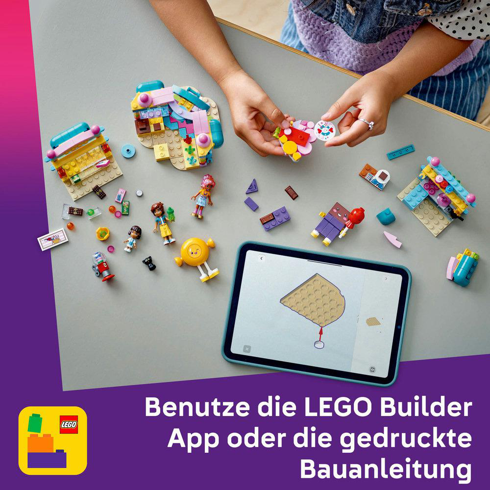 Eine Sammlung von LEGO Friends Sets und Zubehör, mit einem Tablet, das Anweisungen zeigt.