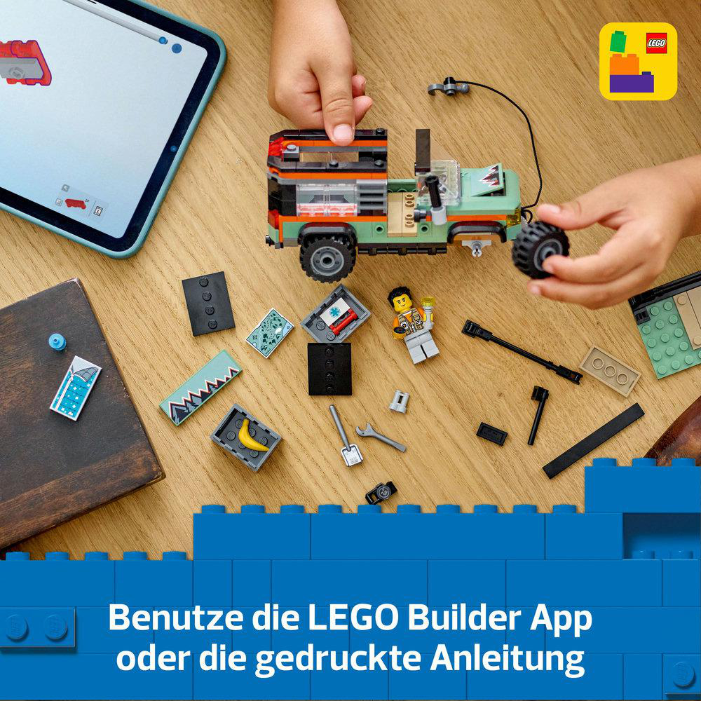 Ein Lego-Set mit einem grünen Jeep und Bauanleitungen auf einem Tablet.