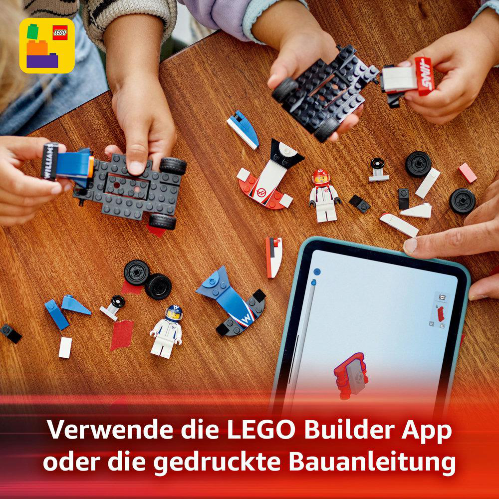Leute bauen LEGO-Sets auf einem Tisch, mit einem Tablet mit Bauanleitungen.