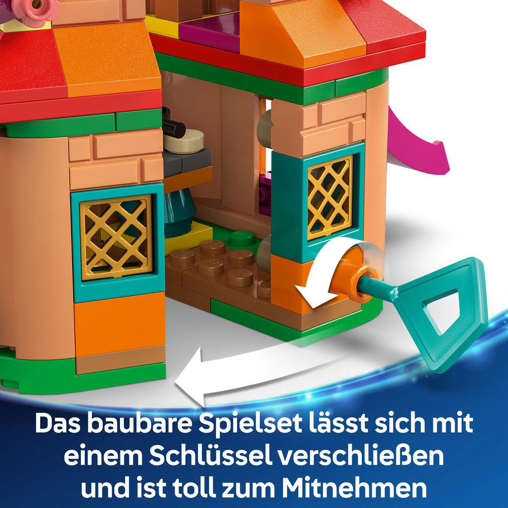 Lego-Set mit einem Gebäude mit Rutsche. Ein Schlüssel dreht ein Schloss am Gebäude.