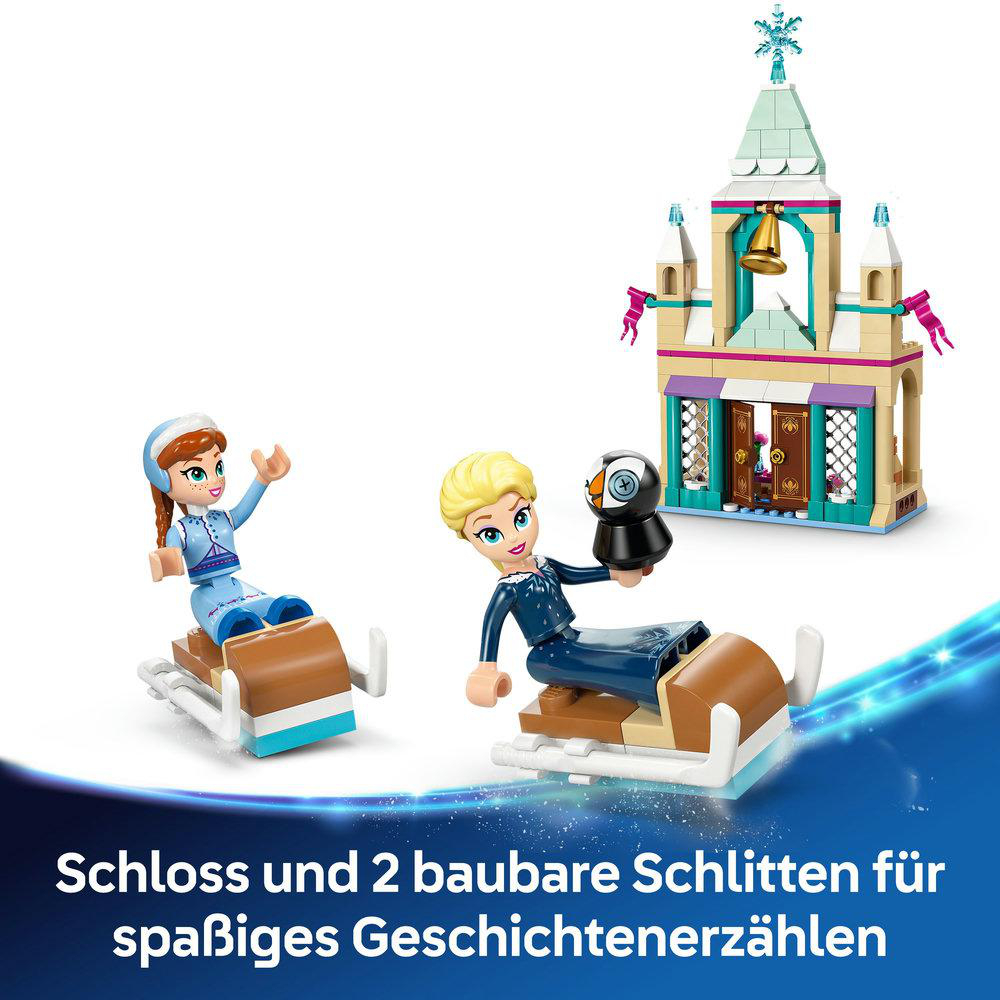 Lego-Set: Zwei Figuren auf Schlitten und ein Schloss mit Glocke und Pinguin.