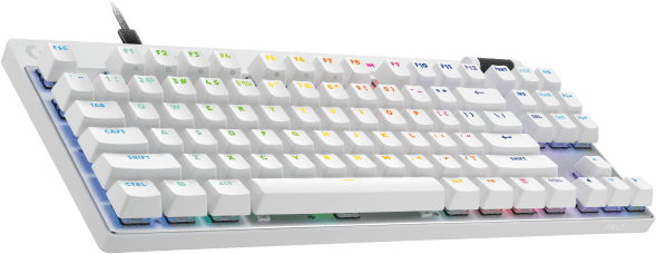 Fehér billentyűzet többszínű gombokkal és vezetékkel. Logitech márka a bal felső sarokban. Zöld háttér.