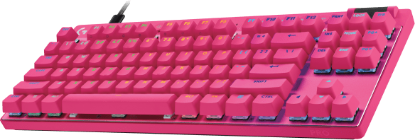 Rózsaszín billentyűzet többszínű gombokkal. Logitech PRO. Zöld háttér. A gombok közeli képe.