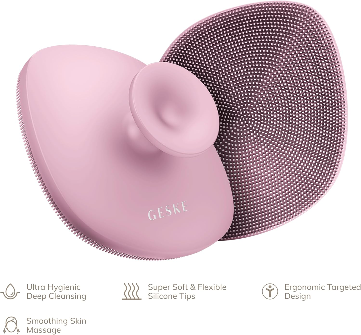 Cepillo de limpieza facial rosa. Tiene mango y cabeza redonda con cerdas pequeñas.