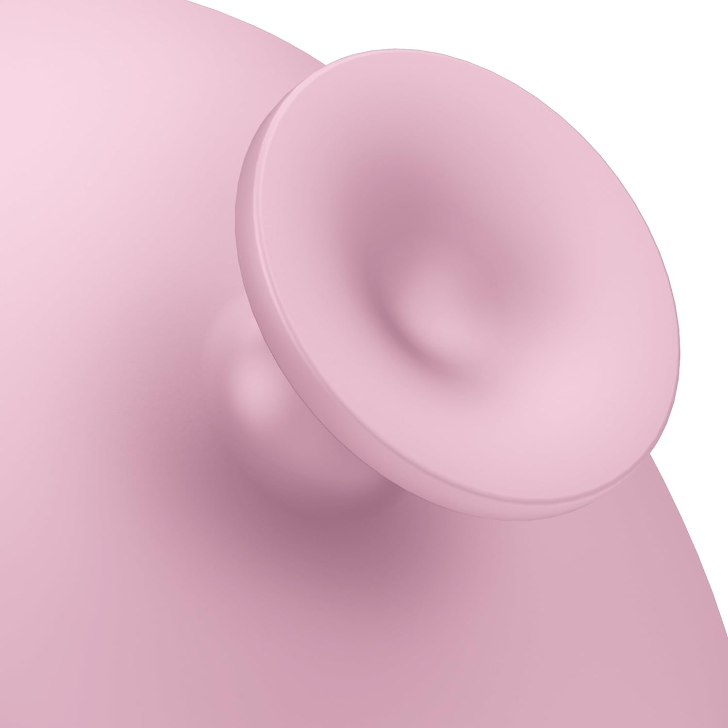 Primer plano de un objeto rosa redondeado con un detalle en forma de embudo.
