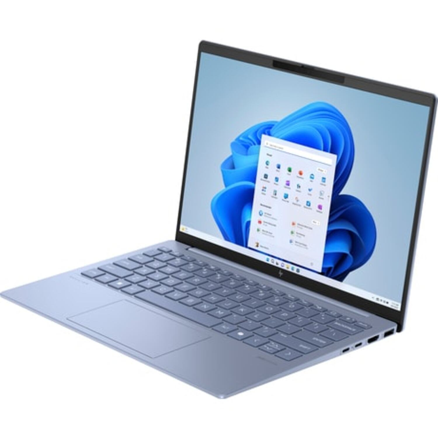 Un ordinateur portable bleu est ouvert sur un bureau avec un clavier bleu clair et un écran de fenêtre.