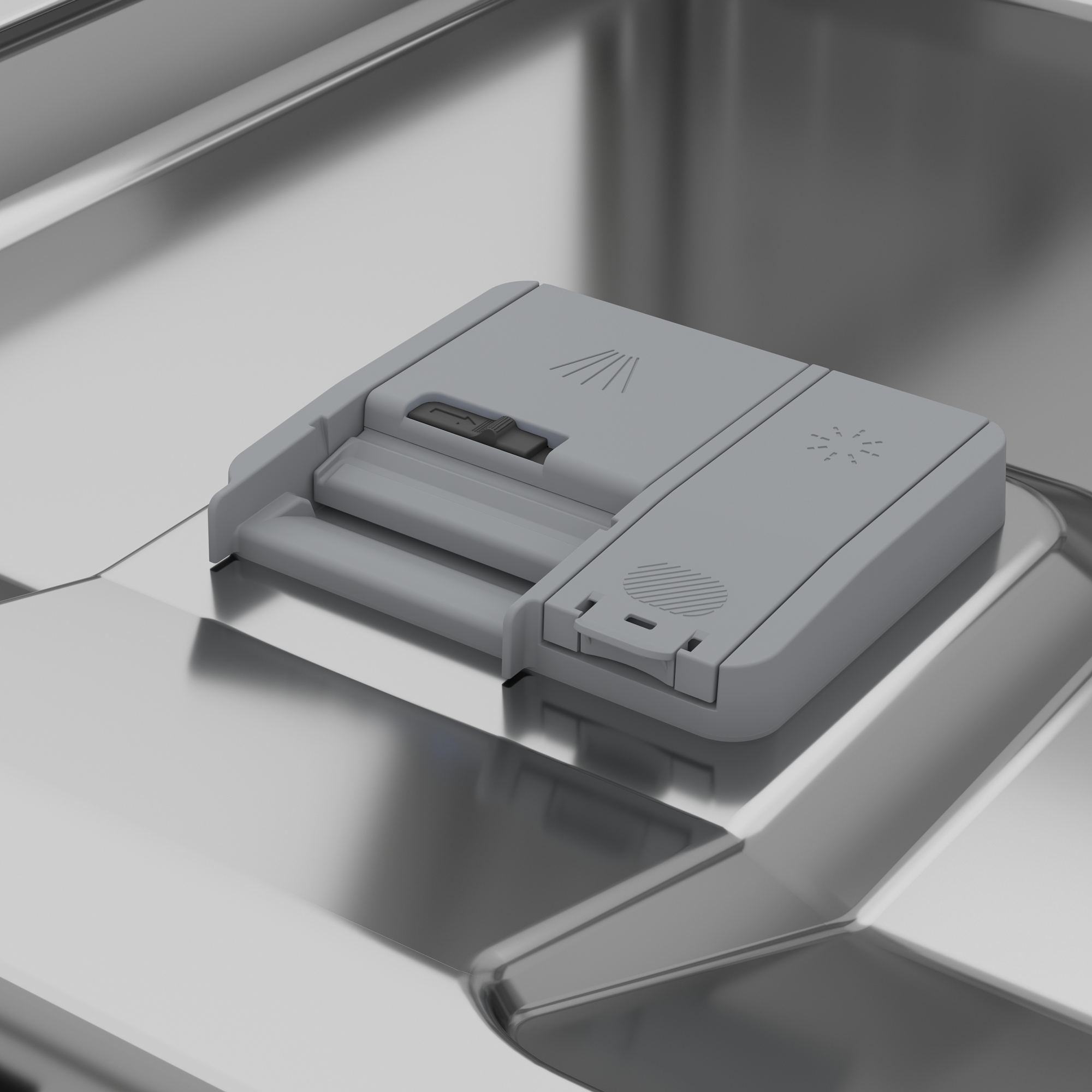 Wnętrze zmywarki z dozownikiem detergentu. Szary dozownik w środku.