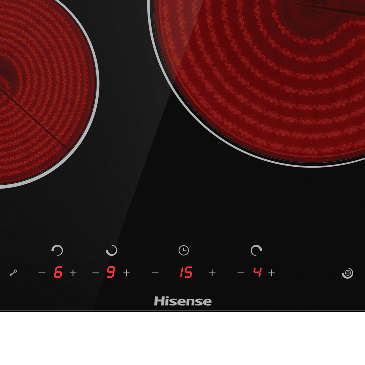 Primer plano de una placa de inducción negra, dos elementos calefactores rojos están encendidos. Pantalla digital.