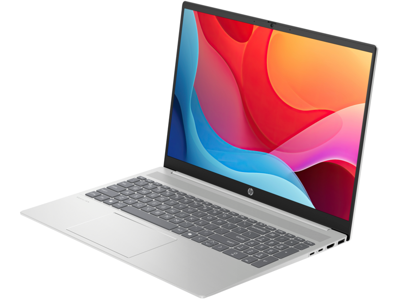 Ezüst laptop színes absztrakt kijelzőt mutat.