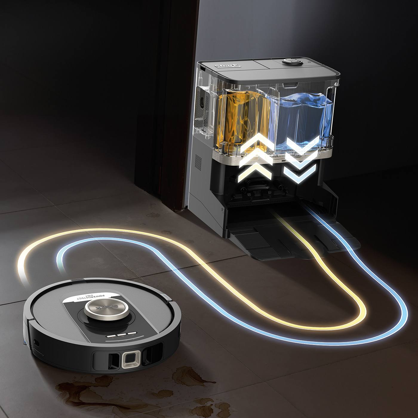 Un aspirateur robot et une station de charge avec des conduites d'eau.