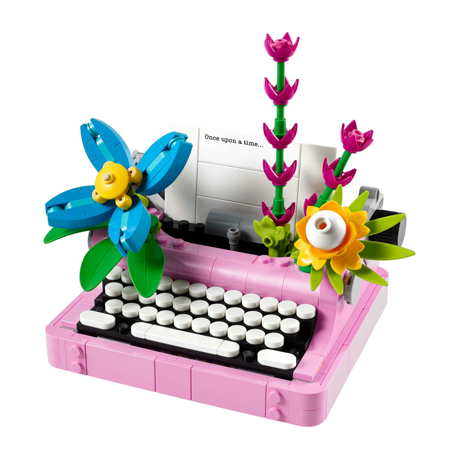 LEGO macchina da scrivere. Base rosa con tastiera nera, fiori e un foglio di carta.