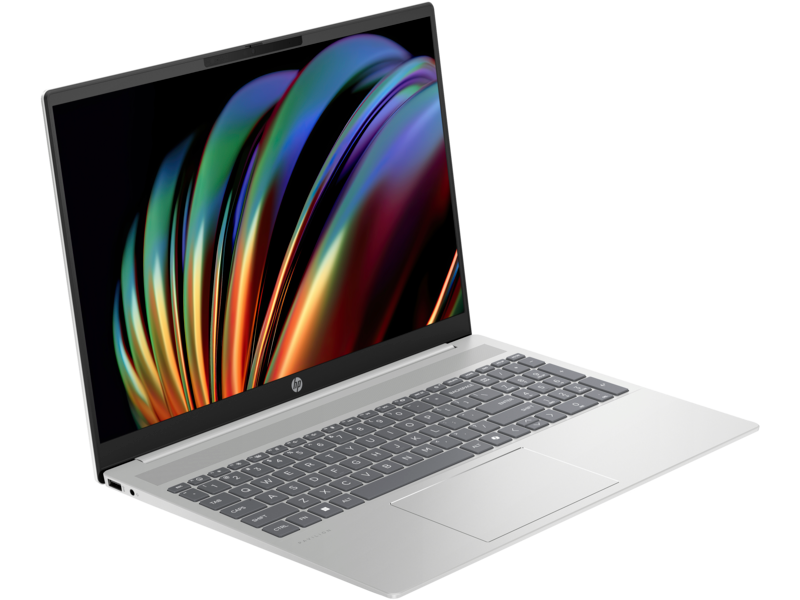 Ezüst laptop nyitva, billentyűzettel és színes absztrakt művészettel.
