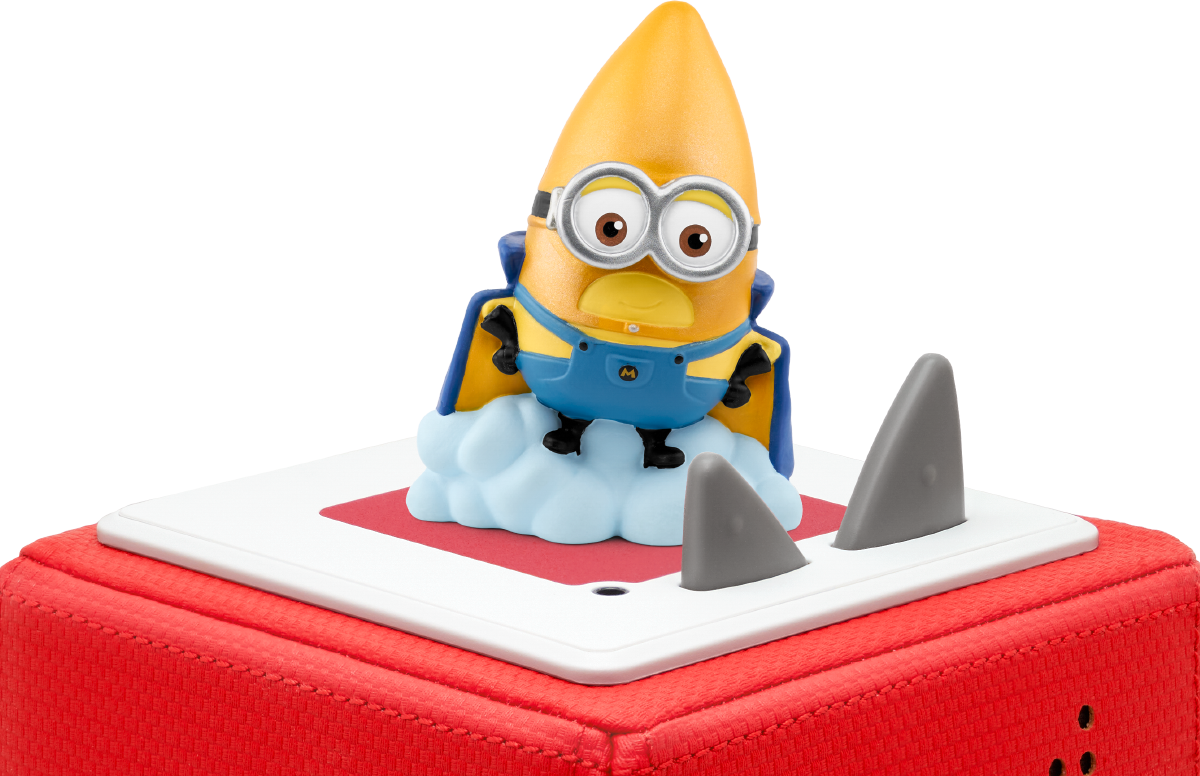 Eine Minion-Figur mit Umhang und Brille sitzt auf einer Wolke, flankiert von zwei grauen Haifischflossen, auf einer rot-weißen Oberfläche.